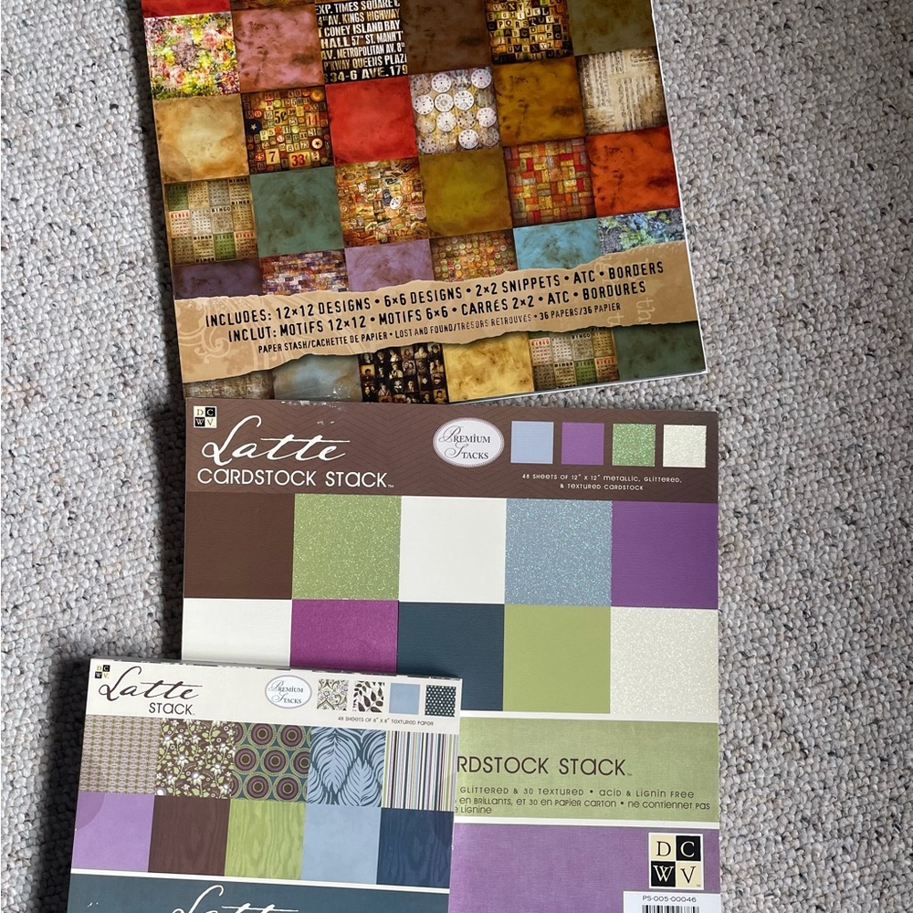 Scrapbook and card making cardstock paper by Tim Holtz and DCWV. 12x12 and 8x8.